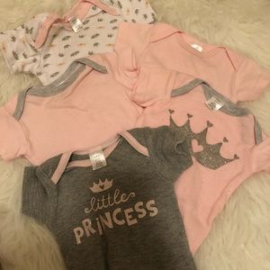 Five piece set of princess Onesies by Baby Kiss